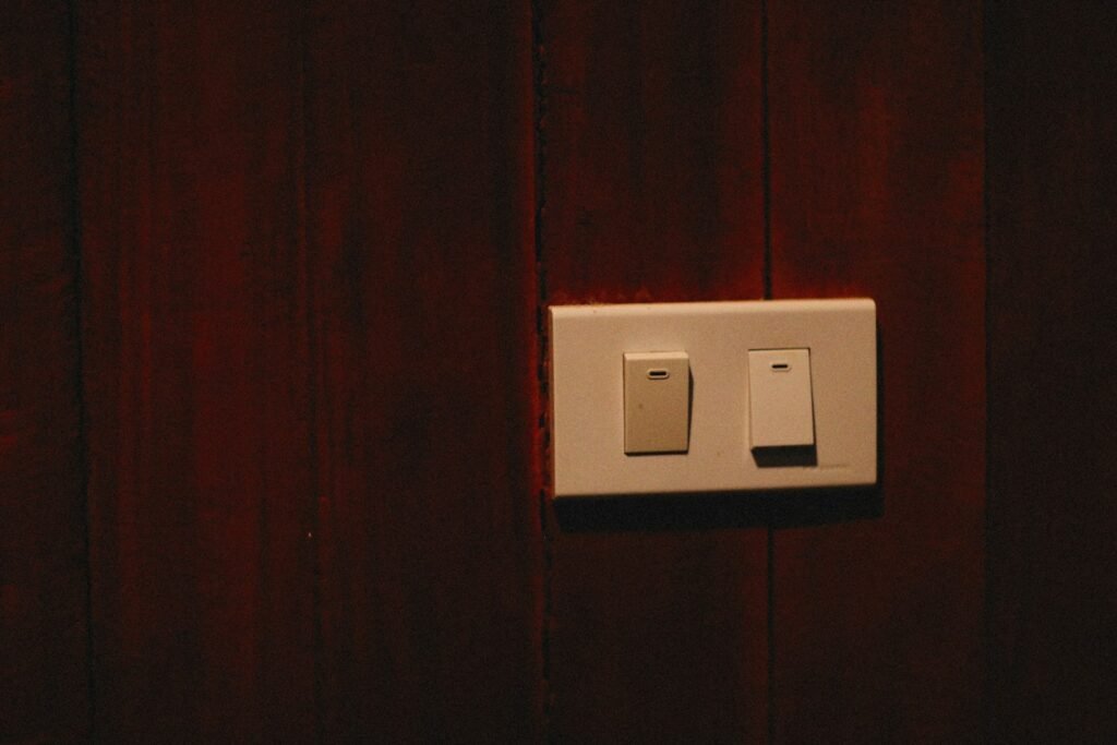 White modular switch on a warm wooden wall