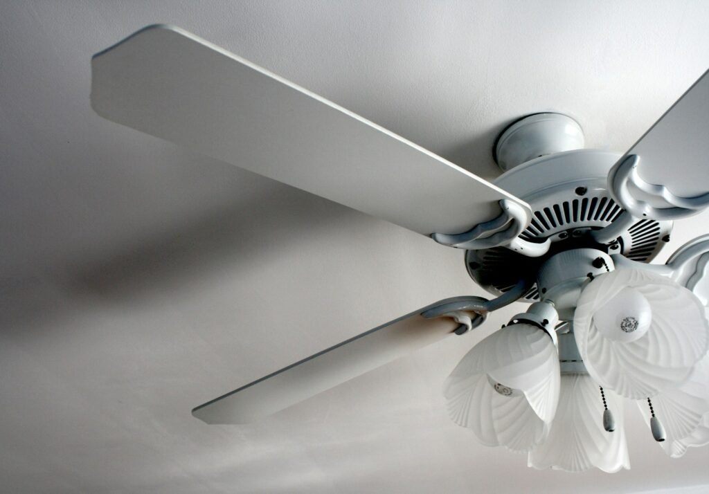 White designer ceiling fan in a bright, quiet room